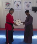 Master Michael Tan receiving his Kumdo Instructors certificate from Master Peter